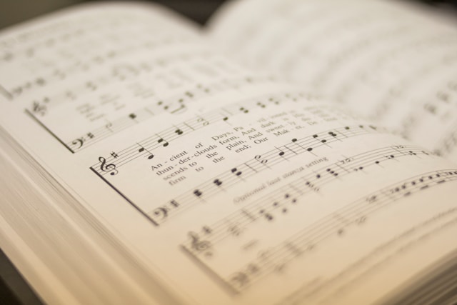 music book with musical notes and words to a song